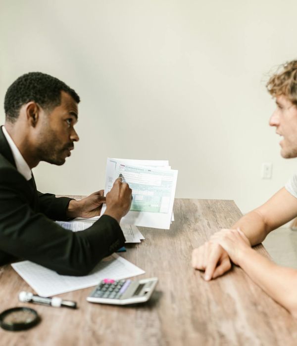 Man business analyst reviewing strategic documents in professional setting